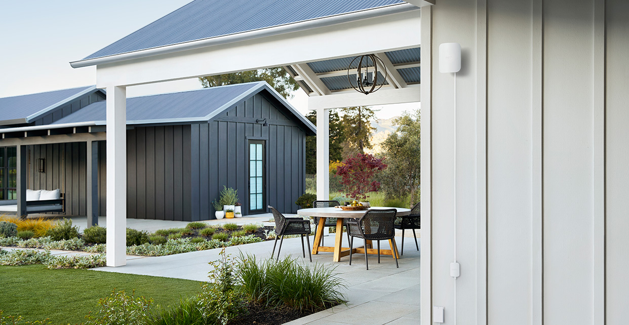 eero Outdoor 7 mounted beside a covered patio